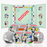 Monopoly-themed silver coins with game board design in the background
