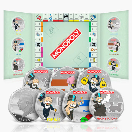 Monopoly-themed silver coins with game board design in the background