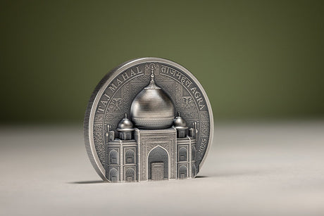 Left-angled view of the freestanding Taj Mahal silver coin, showing its reeded edge, domed relief and intricate entrance.