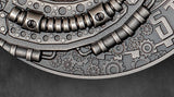 Close-up of a metallic gear design on a dark background