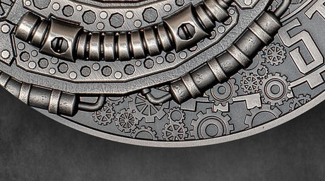 Close-up of a metallic gear design on a dark background