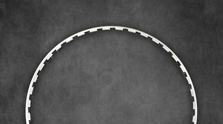 Bicycle wheel rim on a dark textured background