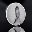 Cook Islands 2026 Tiger 3oz silver coin, showing a white tiger amid striped camouflage on a reflective black surface.
