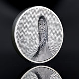 Cook Islands 2026 Tiger 3oz silver coin, showing a white tiger amid striped camouflage on a reflective black surface.