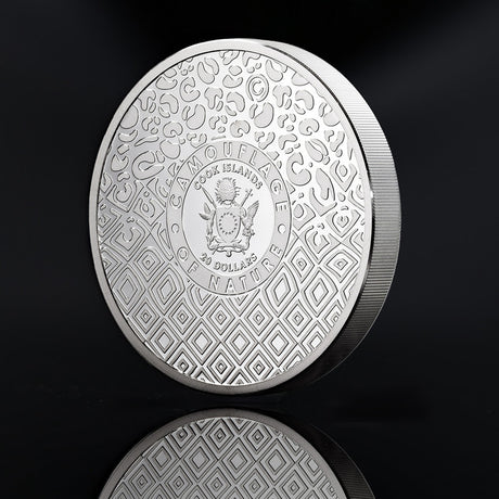 Cook Islands Tiger coin obverse with the coat of arms, 20 Dollars inscription and geometric camouflage pattern.