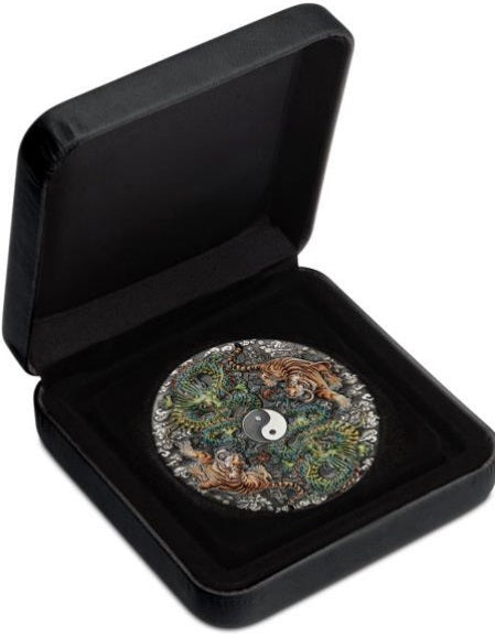 Open black clam shell case showing Tuvalu 2023 5 dollar Double Dragon and Double Tiger 5oz silver antiqued coloured coin reverse side featuring two dragons and two tigers around a colourful yin yang symbol. The coin is nested in a plush velvet  insert.