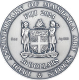 Obverse of 2024 Fiji Notre Dame Coin. Showing the Coat of Arms of Fiji, a legend inscribed with "10th Anniversary of Mandala Art Series", :10 Dollars" "Fiji 2024" "5oz" and "Ag 999".