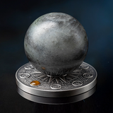 Decorative stone sphere on a metallic base with a dark misty background