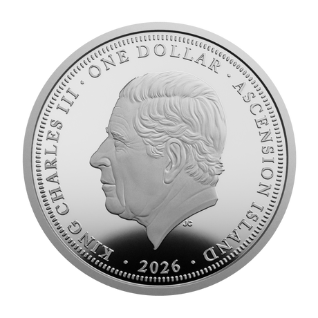 A round silver-colored commemorative coin featuring a profile portrait of King Charles III, with the text 'ONE DOLLAR', 'ASCENSION ISLAND', and '2026' around the edge, shown on a plain white background.