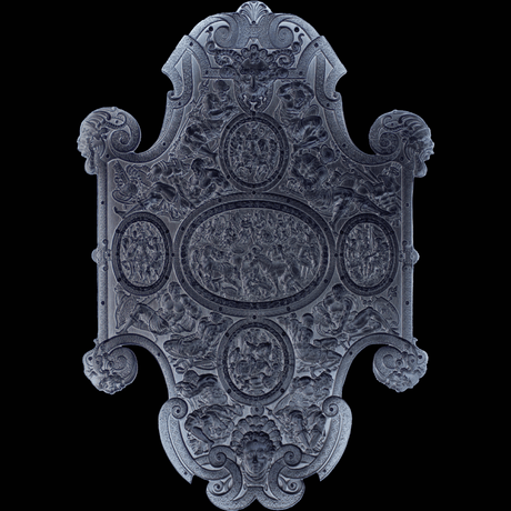 Decorative silver stacker shield with intricate designs on a black background Reverse side or underside of stacker 