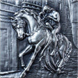 A silver coin with an antique finish depicting a historical figure on horseback, accompanied by a detailed architectural background.