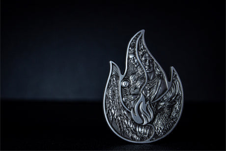 Full view: Full view of the flame-shaped Eternal Flame silver stacker against a dark background.