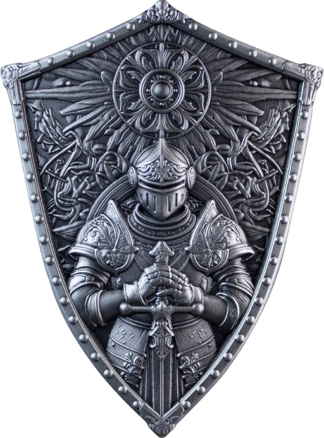 Front: Crusader’s Shield silver stacker showing an armoured knight holding a sword beneath a circular floral emblem and radiating ornament.