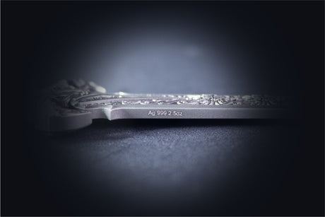 Side view of the Sword of Chiwoo silver medal, showing its thickness and Ag 999 2.5oz edge inscription.