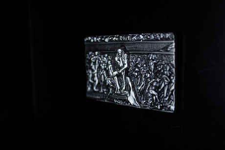 Angled view of The Thinker rectangular silver stacker, showing the depth of its sculpted relief.