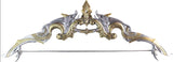 Decorative bow with intricate silver and gold design on a white background