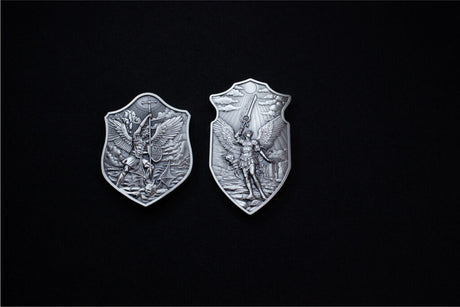 Shield of St. Uriel silver stacker displayed beside a smaller angel-themed shield on a dark background