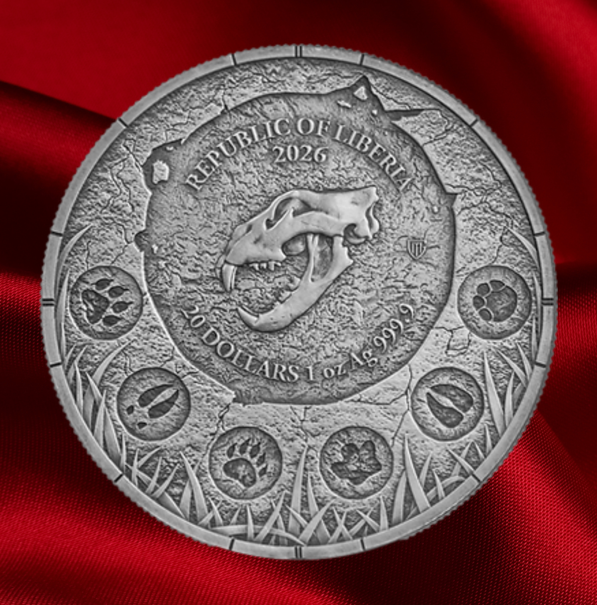 A round silver-toned coin featuring a lion skull and the text 'REPUBLIC OF LIBERIA 2026' and '20 DOLLARS 1 oz 99.99%'.