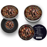 A circular decorative coin or medallion featuring a Day of the Dead style portrait of a tattooed woman with red roses, skulls, candles, and ornate jewelry, holding a revollver and smoking a cigar with the text '1 ONZA PLATA PURA 2024 LEY .999' around the border, shown against a dark blue background. The Coin is in a Tin with an open lid. Next to it is a closed tn and a certificate of authenticity.
