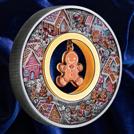 Australia 2026 Gingerbread Christmas silver coin, featuring a coloured gingerbread village and dangling enamelled gingerbread man in its open centre.