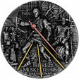 2022 Niue D’Artagnan 2oz silver coin reverse with a Paris duel scene and gold and rose gold-plated swords.