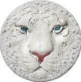 A silver coin with a high relief design depicting the head of a white tiger.