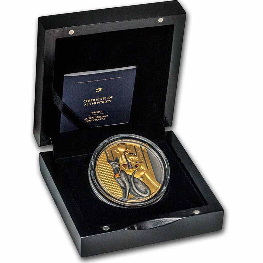 A product shot of the complete packaging set for the 2023 Niue $5 "Lady Flame" 2-ounce silver coin. It includes a sturdy, matte black presentation box paired with a matching protective outer sleeve. The design features a dramatic, fiery red and metallic gold illustration of the goddess Sekhmet surrounded by flames. The name "LADY FLAME" is prominently displayed in a sleek, modern font alongside the coin's technical specifications.