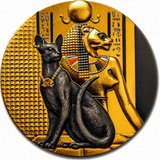 The reverse side of the 2023 Niue $5 "Lady Flame" 2 oz antiqued silver coin. It features a detailed high-relief engraving of the lion-headed Egyptian goddess Sekhmet in profile. A black cat sits in the foreground wearing a necklace embedded with a vibrant red Swarovski crystal. The background features ancient Egyptian hieroglyphs set against shimmering, selective gold gilding.