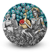 The image on the coin shows Hera with a peacock. Hera is feeding the peacock a pomegranate and the Peacocks feathers are in display with Aquamarine Crystal inserts. To the left is a pregnant woman and a man. The Peacock Body is gilded. His feathers are coloured. Flowers populate the foreground in antiqued silver. 23 sparkling Aquamarine Crystals adorn the feathers. White background small shadow at base of standing coin.