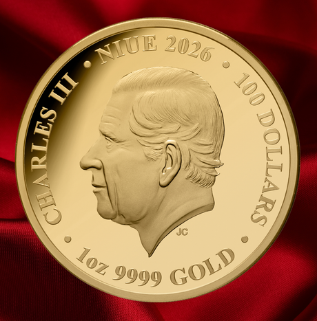 A round gold commemorative coin featuring a profile portrait of Charles III, with raised text reading 'CHARLES III', 'NIUE 2026', '100 DOLLARS', and '1 oz 9999 GOLD', photographed against a rich red satin background. - FORTYMILLION