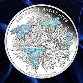 Niue 2026 Native Australian Bees 5 oz silver proof coin, Four beepolinating a flower with hologram detai on a blue satin background.