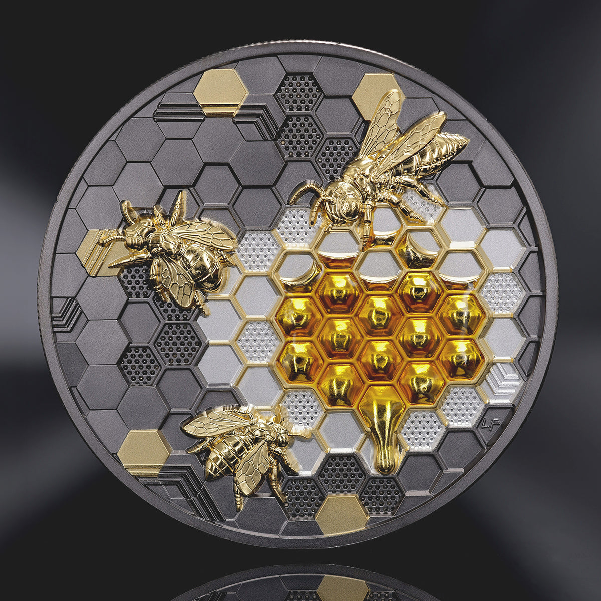 A round collectible coin featuring a honeycomb and bee design, with gold and silver metallic elements of honey filled Honeycom on a dark gray background.