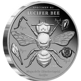 Angled reverse: Angled view of the 2026 Lucifer Bee Black Proof silver coin showing the bee, anatomical details and ridged edge.