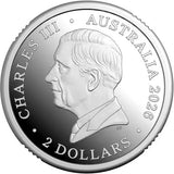 Silver coin with a portrait of a monarch and text 'Charles III Australia 2025 2 Dollars'.