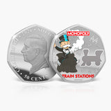 Silver coin with a portrait and Monopoly character on a white background