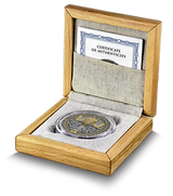 Silver coin with certificate of authenticity in a wooden box