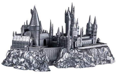 Metallic model of a castle on a rocky base with a white background