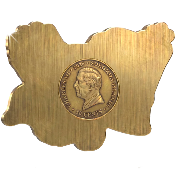 A gold-colored metal plaque shaped like the map of Solomon Islands, featuring a central circular relief of a profile portrait and the text 'CHARLES III • 2026 • SOLOMON ISLANDS • 50 CENTS'.