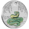 A colored coin with an image of a snake on it, surrounded by a silver border, with Inscription Year of the Snake 2025.