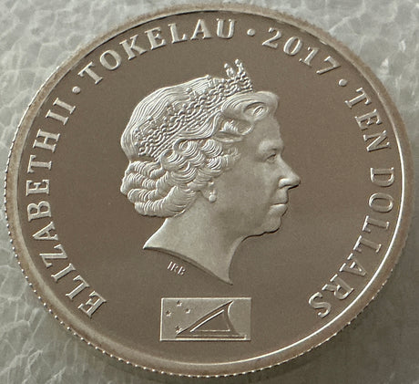 Silver coin with a profile of a queen and text around the edge, featuring the year 2017 and the value 'Ten Dollars'.
