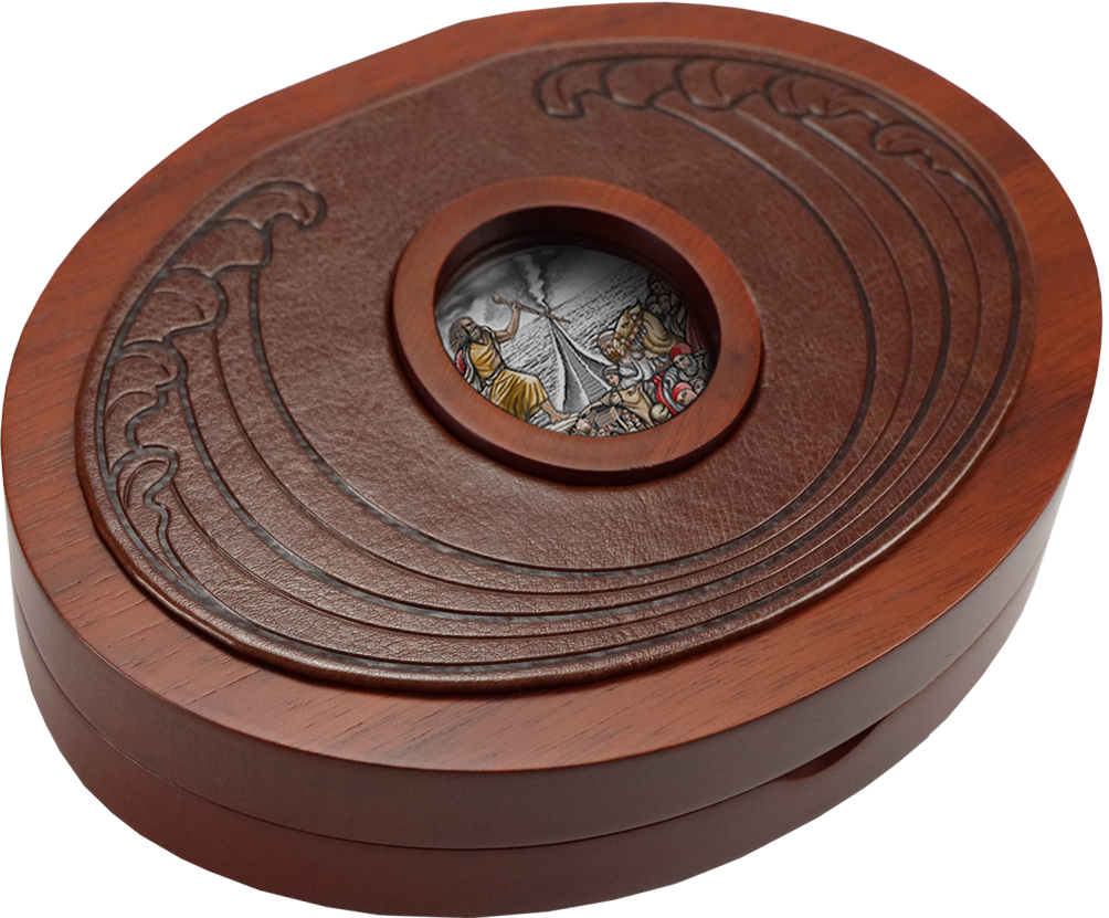 A closed, dark wooden presentation box for the 2023 Tokelau $10 "The Exodus" 5 oz silver coin. A circular porthole window built into the shut lid reveals a partial view of the antiqued silver coin inside, showcasing a high-relief glimpse of the parting of the Red Sea waves.