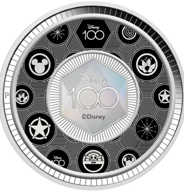 Disney 100th anniversary coin with various Disney logos on a white background