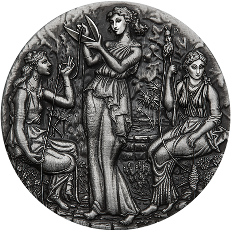 A silver coin with a detailed relief design featuring three ancient goddesses, Clotho, Lachesis, and Atropos, from Greek mythology, within a grove setting.