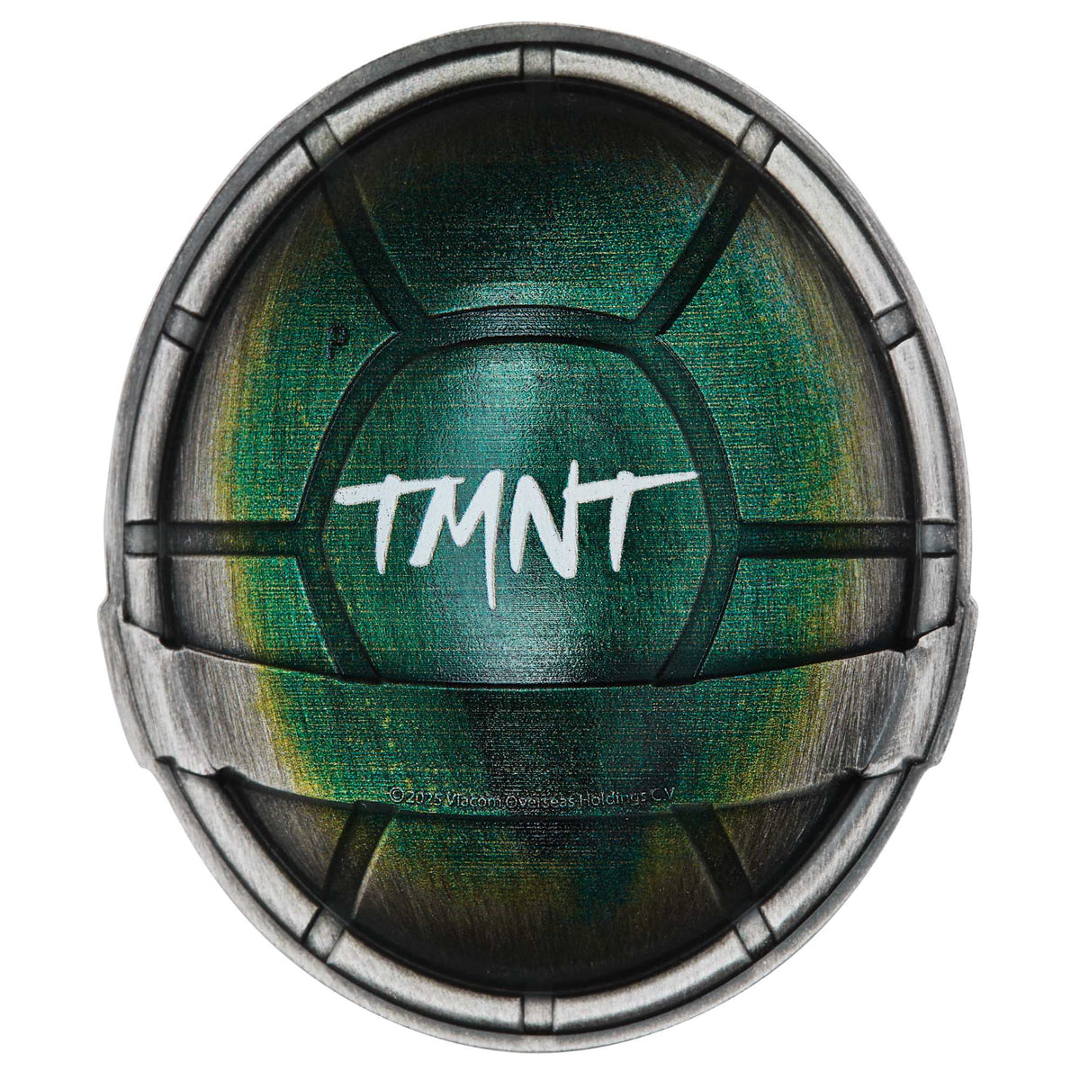 Circular object with green center and metallic rim, featuring 'TMNT' text.