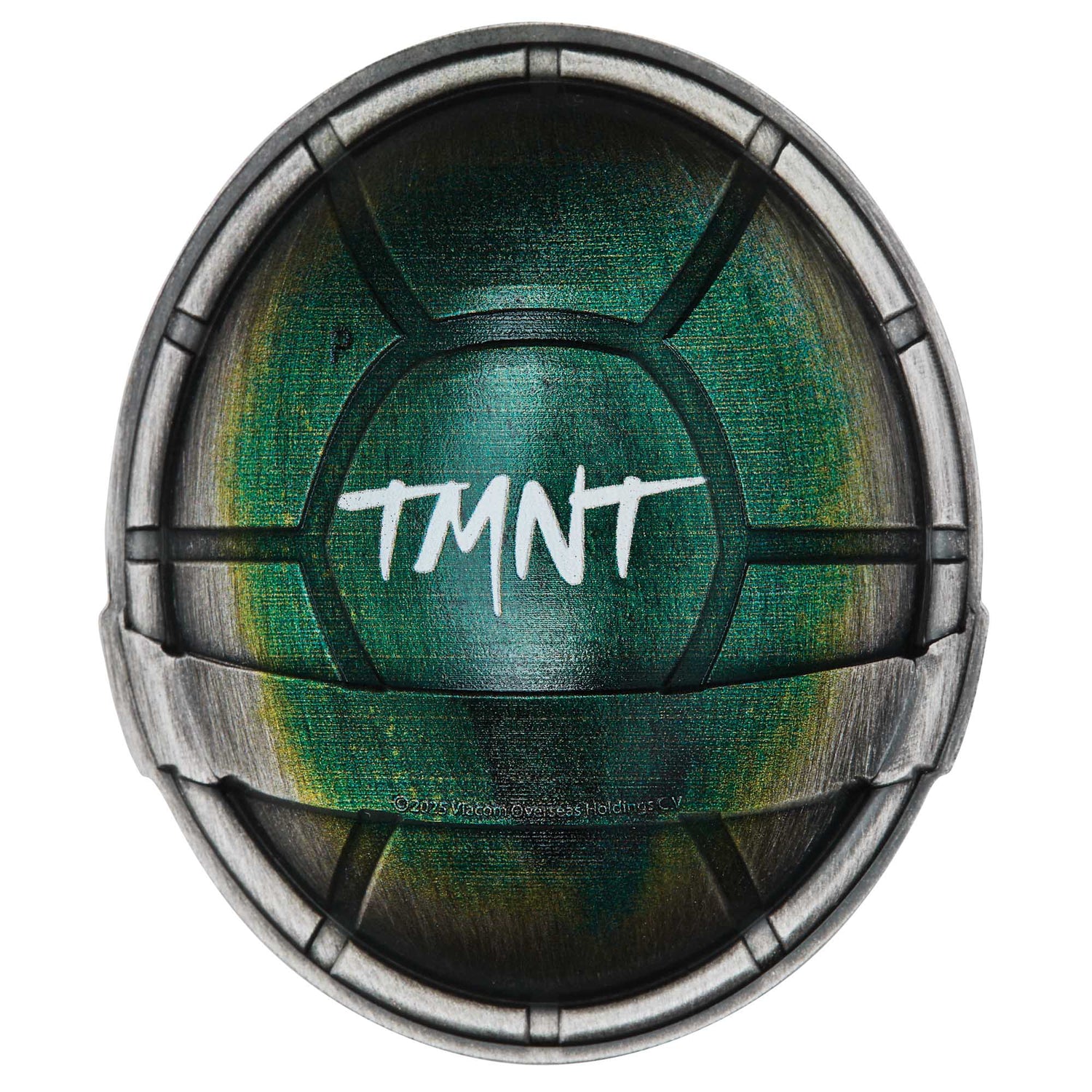 Circular object with green center and metallic rim, featuring 'TMNT' text.