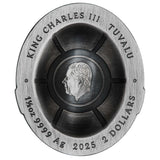 Silver coin with King Charles III's profile and text on a white background