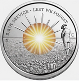 Silver coin with a sunburst design and text 'Dawn Service - Lest We Forget' on a white background