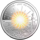 Silver coin with a sunrise and people scene, featuring 'Dawn Service - Lest We Forget' text.