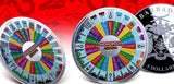 Two Monopoly-themed coins with colorful designs on a red background