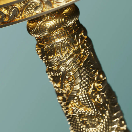 Decorative gold object with intricate patterns on a blue background
